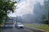 Fire crews have managed to stop the spread of a house fire to neighbouring properties as they say it is "under control" for now.