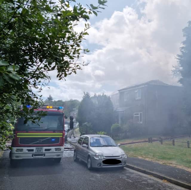 Fire crews have managed to stop the spread of a house fire to neighbouring properties as they say it is "under control" for now.