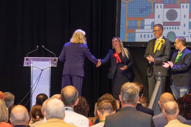 Pictured - Penny Mordaunt shaking hands with Amanda Martin after losing her seat. Photos by Alex Shute