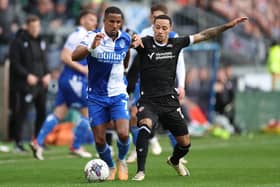 Josh Dacres-Cogley, right, in action against Bristol Rovers last season