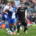 Josh Dacres-Cogley, right, in action against Bristol Rovers last season