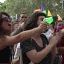 Anti-mass-tourism protesters squirt diners with water guns in Barcelona, Spain.