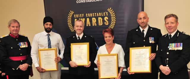 PC Gurdit Singh, PC Roy Kimber, Dee Court, and PC Simon Tate with their commendations.