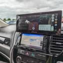 The Carpuride W103 sits on top of your dashboard, or on the windscreen, and gives you full access to Android Auto or Apple CarPlay