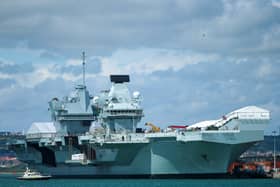 HMS Prince of Wales pictured yesterday with tug boats trying to turn her around, with high winds being blamed for the failed routine manoeuvre. Picture: Chris  Moorhouse (100724-009)
