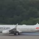 Boeing 737’s tyre explodes, flinging rubber across the runway.