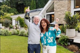Darren & Rachael Reid - Omaze Million Pound House Surrey winners outside their new £3m home 