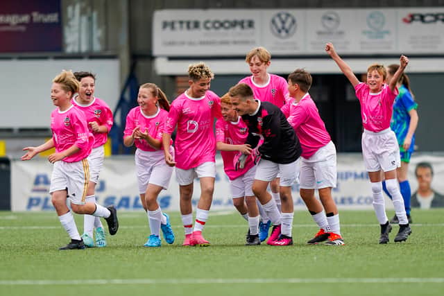 Jacob alongside some of his JLW657 teammates during the match against City Ladies FC. Picture: Jason Brown