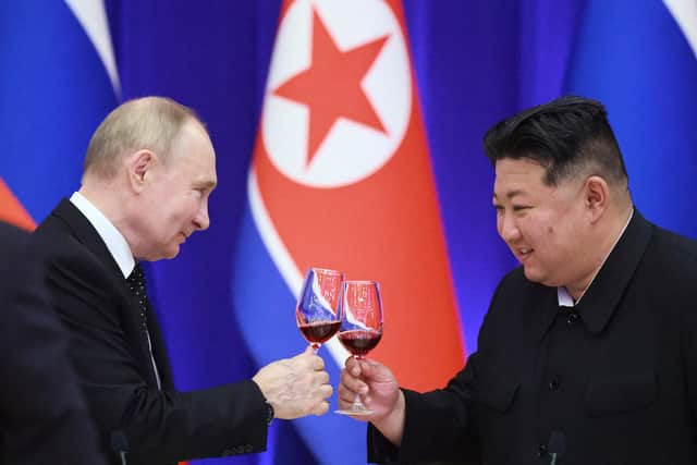Russian President Vladimir Putin and North Korean leader Kim Jong Un toast during a reception at the Mongnangwan Reception House in Pyongyang on June 19, 2024. Photo by VLADIMIR SMIRNOV/POOL/AFP  - Russian state agency Sputnik - via Getty Images.