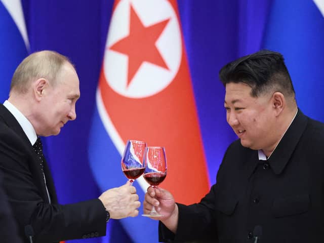 Russian President Vladimir Putin and North Korean leader Kim Jong Un toast during a reception at the Mongnangwan Reception House in Pyongyang on June 19, 2024. Photo by VLADIMIR SMIRNOV/POOL/AFP  - Russian state agency Sputnik - via Getty Images.