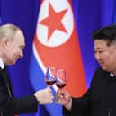 Russian President Vladimir Putin and North Korean leader Kim Jong Un toast during a reception at the Mongnangwan Reception House in Pyongyang on June 19, 2024. Photo by VLADIMIR SMIRNOV/POOL/AFP  - Russian state agency Sputnik - via Getty Images.
