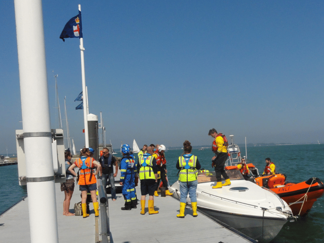A motor cruise carrying a man and a woman burst into flames while sailing in the Solent. Picture: RNLI