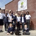 Milton Park Primary School in Portsmouth, has received a good Ofsted report with some outstanding elements.Pictured is: (back l-r) Ros Middleton, deputy headteacher, Anna Young, assistant headteacher and Wedny Fowler, headteacher with some of the children and Mabel the school well-being dog.Picture: Sarah Standing (180724-7326)