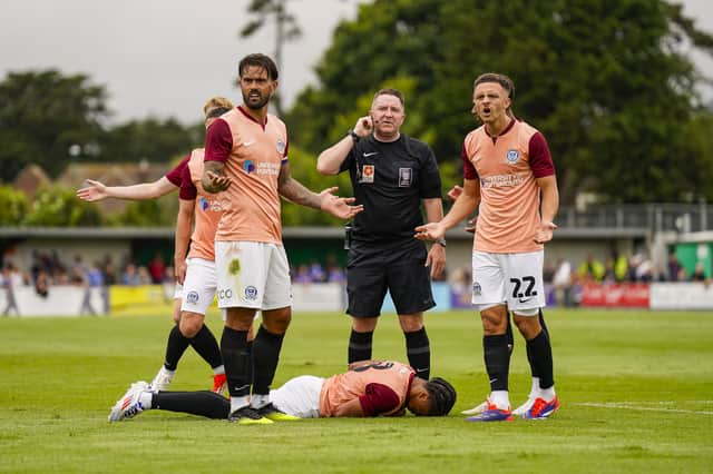 Sammy Silvera is poleaxed in the first half of Pompey's trip to Bognor following a collision with keeper Nick Hall. Picture: Jason Brown/ProSportsImages