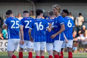 Ryley Towler, second from right, is congratulated following his goal against the Hawks on Fridat night