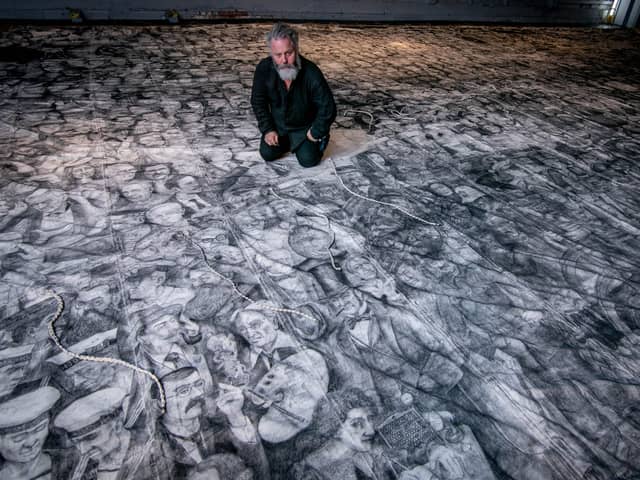 Peter Codling, a renowned Portsmouth-based artist who is currently finalising his extraordinary piece of art, hand-drawn on a replica sail of HMS Victory on Thursday 18th July 2024Pictured: Pete Codling with his artwork at the Historic Dockyard Picture: Habibur Rahman