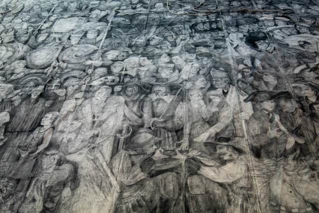 Peter Codling, a renowned Portsmouth-based artist who is currently finalising his extraordinary piece of art, hand-drawn on a replica sail of HMS Victory. 

Pictured: Pete Codling's artwork at the Historic Dockyard Picture: Habibur Rahman