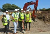 (front right) Cllr Sue Ballard, next to Leader Cllr Peter Chegwyn (front centre) and Cllr Jamie Hutchison (front left), with council housing officers and representatives from PMC Ltd at the Stoners Close site.