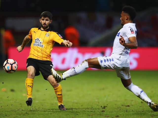 Piero Mingoia (left) in his Cambridge United playing days up against Leeds' Tyler Denton. Picture: Clive Mason/Getty Images)