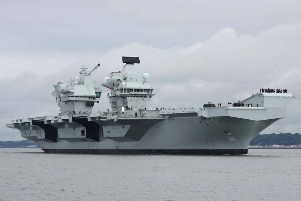 HMS Queen Elizabeth will be performing gun salutes while off the coast of the Isle of Wight, before returning to HMNB Portsmouth.