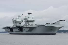 HMS Queen Elizabeth will be performing gun salutes while off the coast of the Isle of Wight, before returning to HMNB Portsmouth.