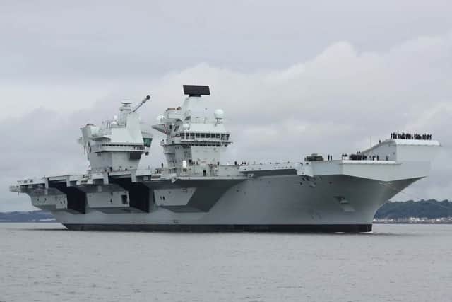 HMS Queen Elizabeth will be performing gun salutes while off the coast of the Isle of Wight, before returning to HMNB Portsmouth.