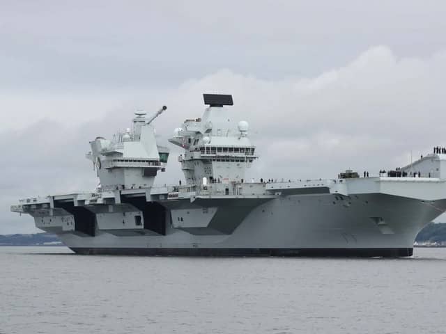 HMS Queen Elizabeth will be performing gun salutes while off the coast of the Isle of Wight, before returning to HMNB Portsmouth.