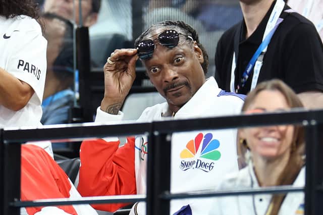Snoop Dogg cheering on fellow American Simone Biles in the gymnastics