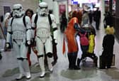 Cosplayers attend the MCM Comic Con at ExCeL exhibition centre in London on October 27, 2023. (Photo by HENRY NICHOLLS / AFP) 