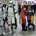 Cosplayers attend the MCM Comic Con at ExCeL exhibition centre in London on October 27, 2023. (Photo by HENRY NICHOLLS / AFP) 