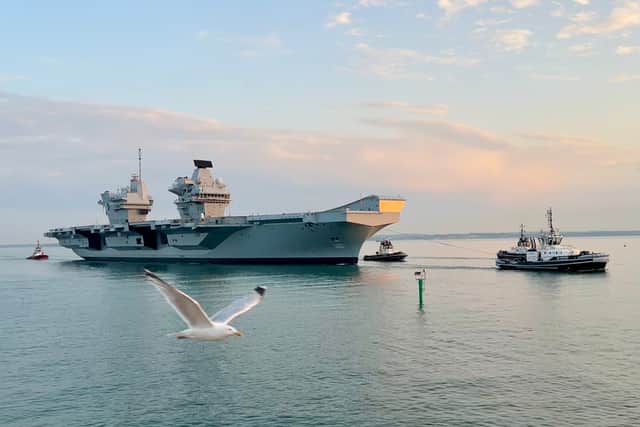 HMS Queen Elizabeth returned to Portsmouth on July 30 after spending several months in Scotland for repairs. Crowds packed The Round Tower and the Hot Walls to welcome her home.