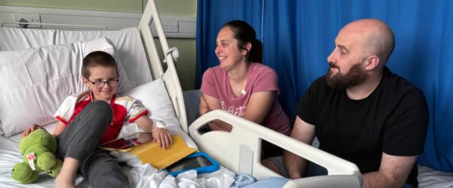Gosport's Reece Wilton with Mum Elizabeth Wilton and Dad Ashley Wilton. The seven-year-old has become the first patient in the UK to undergo robotic surgery for a kidney condition.
Photo: Southampton Children's Hospital/PA Wire