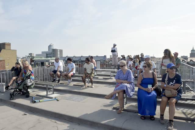 People waiting to see HMS Prince of Wales on top of The Round Tower in Old Portsmouth. Picture: Sarah Standing (010824-8029)