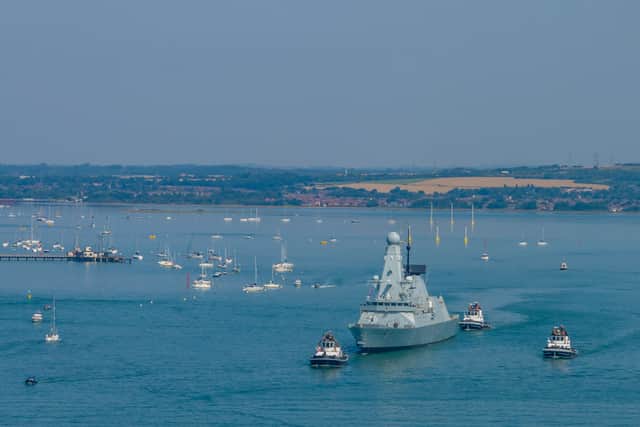 HMS Dauntless leaving Portsmouth on August 1 after two previous sailing dates were cancelled. Pictured is a drone shot of the Type 45 destroyer sailing past The Round Tower in Old Portsmouth.