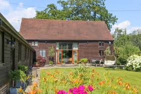 This stunning home comes with five bedrooms, three bathrooms and four reception rooms. 
