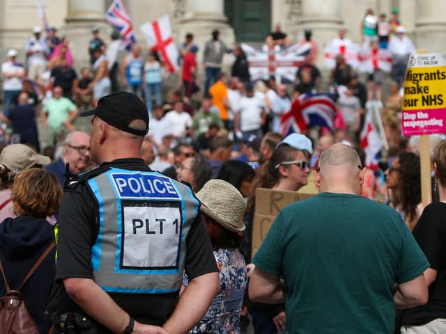Protestors at Guildhall Square, Portsmouth, a demonstration which was sparked by three children being killed in Southport, Merseyside. Picture: Chris  Moorhouse (030824-28)