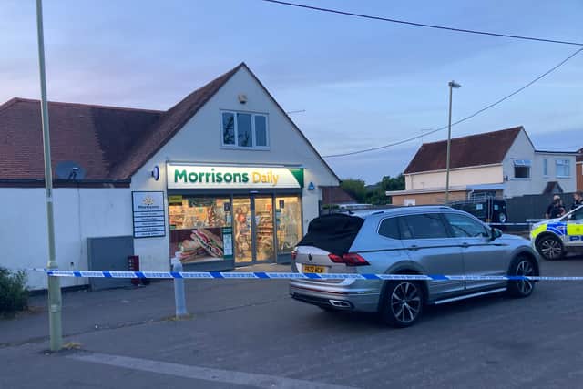 Police outside Morrisons where stabbing took place