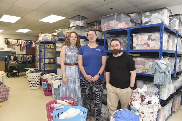 The Parenting Network have opened a Baby Bank at The Fratton Bridge Centre. Vicky Chapter, fundraising manager, Terri Canning, families project co-ordinator and Matt Foster, CEO of The Parenting Network, stand next to the donations made to The Baby Bank.