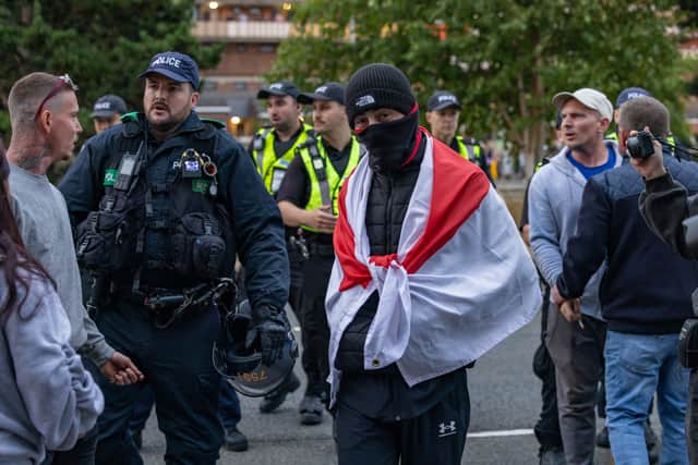 Policing the Anti-immigration protest near the UK Border Agency Building in Portsmouth. Picture: Mike Cooter (070824)