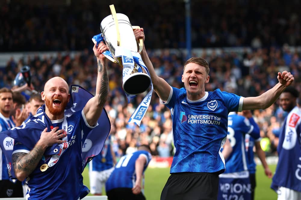 Harry Jewitt-White pictured alongside Connor Ogilvie with the League One trophy. Picture: Peter Nicholls/Getty Images