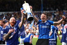 Harry Jewitt-White pictured alongside Connor Ogilvie with the League One trophy. Picture: Peter Nicholls/Getty Images