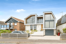 The listing says: "A stunning bespoke designed detached house, enviably situated on the seafront offering superb coastal views and excellent access to the beach opposite."