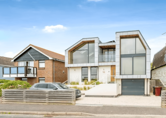 The listing says: "A stunning bespoke designed detached house, enviably situated on the seafront offering superb coastal views and excellent access to the beach opposite."