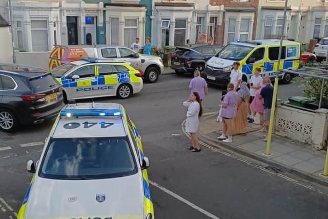 Residents watch on following the incident in New Road East 