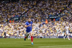 Pompey's Callum Lang heads to the Pompey faithful after sparking wild scenes with his stoppage time penalty at Leeds United. Pic: Jason Brown/ProSportsImages