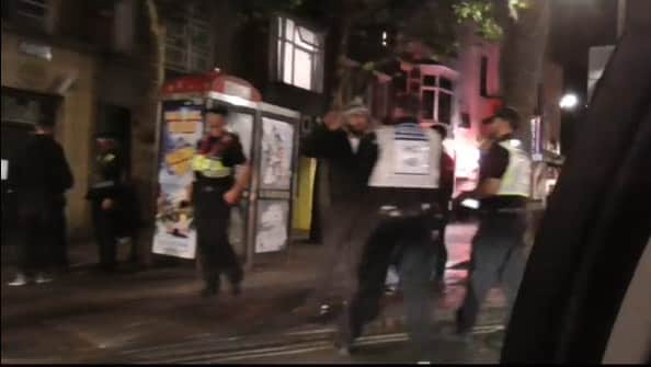 Police speaking to people in Guildhall Walk