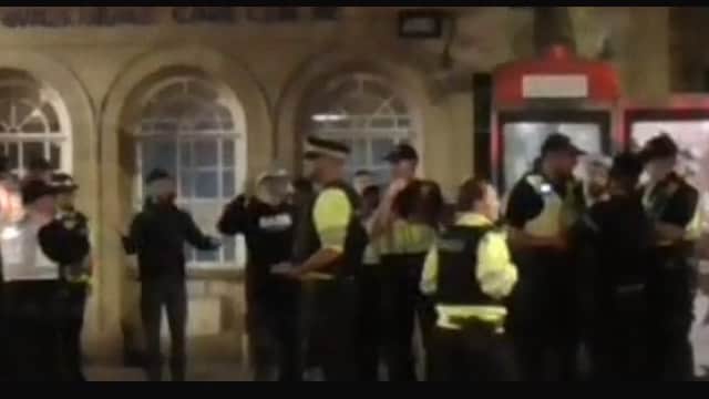 Police speaking to people in Guildhall Walk