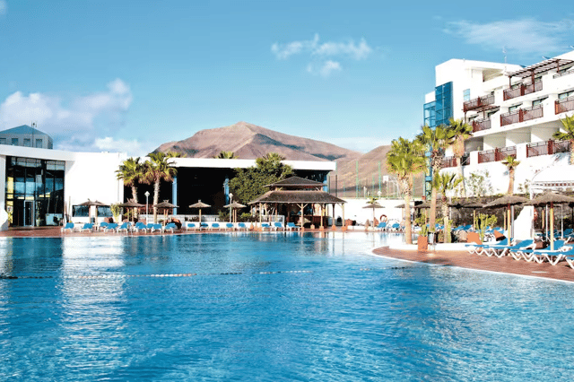 Relax by the pool at Sandos Papagayo