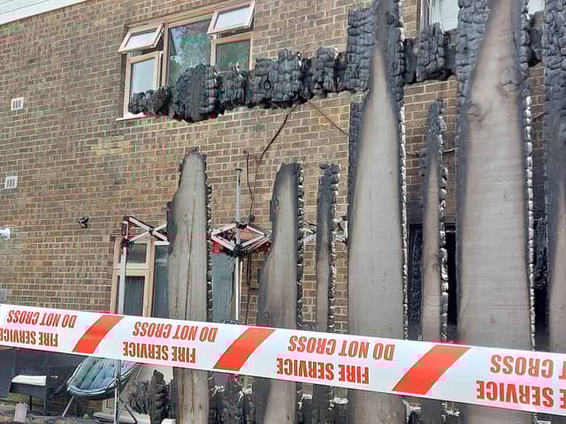 The fence and shed caught fire before spreading to the property.