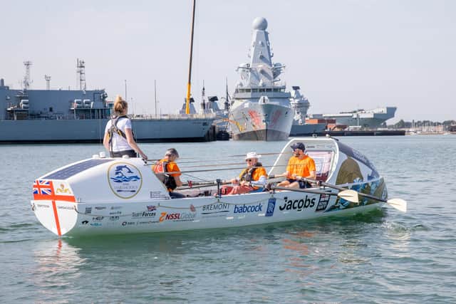 Pictured - Commander Charles Wylie (Retired) aboard HMS Oardacious alongside other sailors.